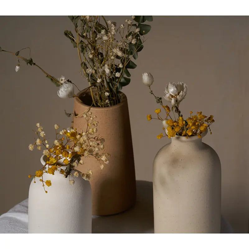 Simple Ceramic Vase quality vase featuring elegant floral arrangements in three distinct ceramic vases.