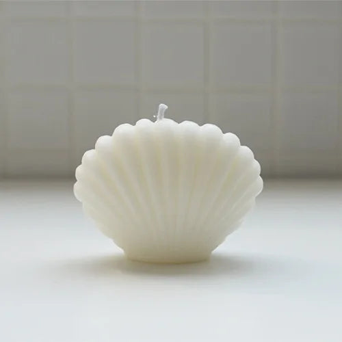 Shell candle home decoration designed for elegant home decor and coastal warmth.