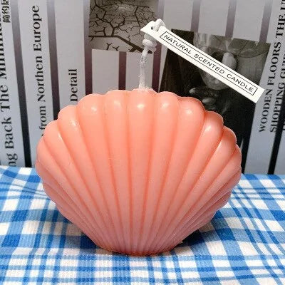 shell candle home decoration on a blue checkered tablecloth, adding coastal charm and elegance to home decor