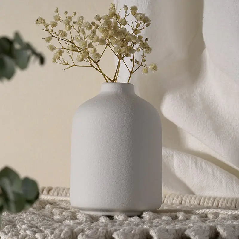 Simple Ceramic Vase quality vase featuring a smooth white ceramic finish with dried flowers.