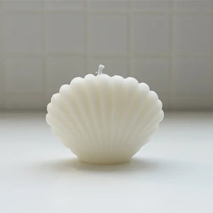Shell candle home decoration designed for elegant home decor and coastal warmth.