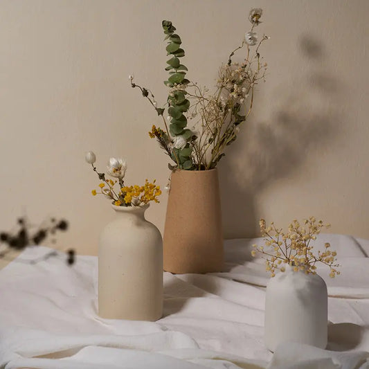 Simple Ceramic Vase quality vase with dried flowers, elegantly displayed on a white fabric backdrop.